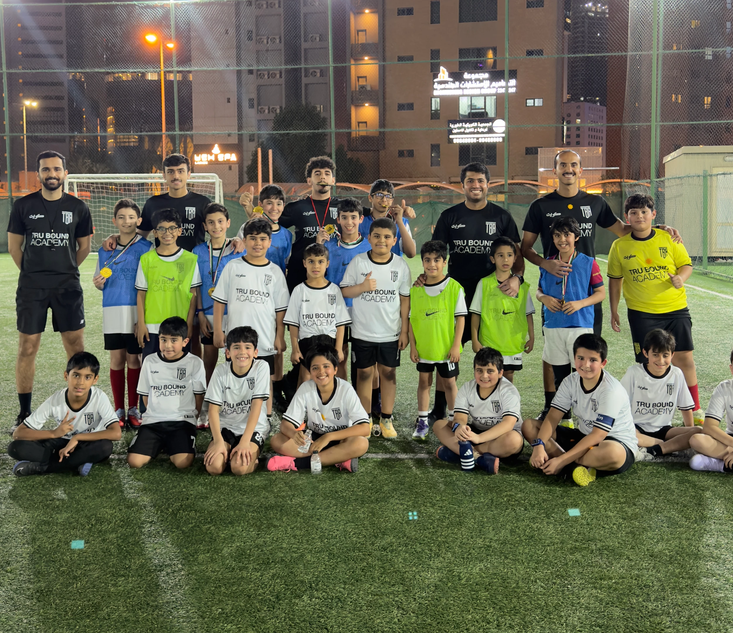 Tru Bound Academy players and coaches at the Bneid Al-Gar location
